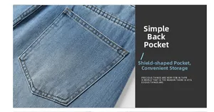 Detail view of the washed blue denim jeans featuring a classic shield-shaped back pocket