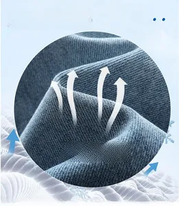 Detail of breathable Tencel fabric showing the soft texture of blue denim pants