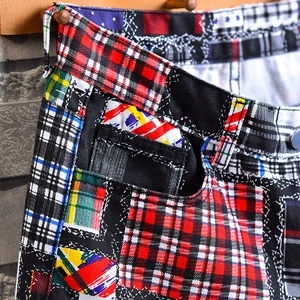 Men's relaxed fit plaid patchwork denim shorts with mixed patterns and cargo pockets