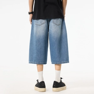 Men's loose fit washed blue denim wide leg shorts featuring a classic back pocket design