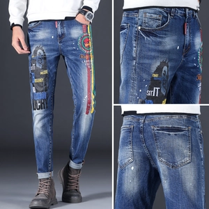 Slim fit deep blue washed men's jeans with Bob Marley embroidery and music elements