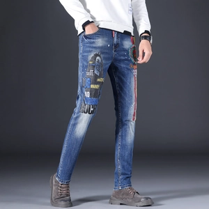 Slim fit men's vintage washed blue denim jeans with Bob Marley portrait and side stripes