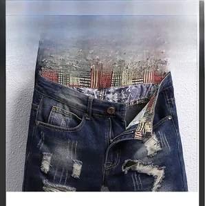 Detail of distressed denim shorts showing vintage patchwork lining and metal hardware