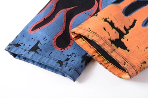 Detailed view of high-street skull graffiti denim with vibrant blue flame print textures