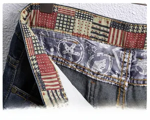 Detail of denim shorts featuring American flag pattern waistband and nautical printed lining