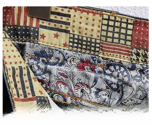 Detail of multi-color patchwork waistband with paisley lining and star embroidery