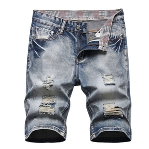 Men's distressed denim shorts in light blue wash with ripped details and plaid inner waist