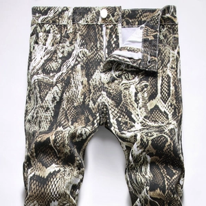 Men's slim fit jeans featuring realistic brown snake print pattern and silver buttons