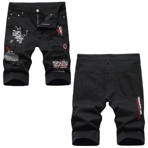 Distressed black denim shorts for men featuring white and red graffiti street style prints