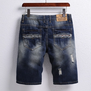 Men's retro blue washed denim shorts with ethnic embroidery and ripped details
