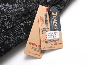 Detail view of black printed denim jeans showing fabric texture and size 31 tag