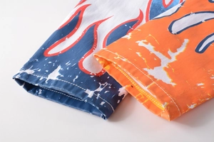 Detail of 3D flame graffiti print on white slim jeans with double stitching