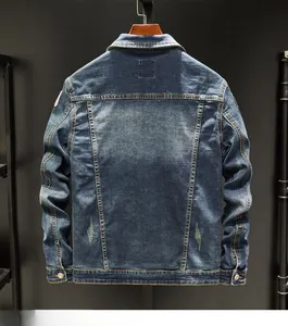 Close-up showing vintage washed denim texture and distressed details on jacket hem