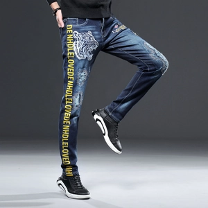 Jean denim stretch pour hommes avec broderie tigre et détails de bande latérale