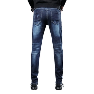 Jean en denim bleu stretch coupe ajustée pour homme avec broderie tête de tigre et usé