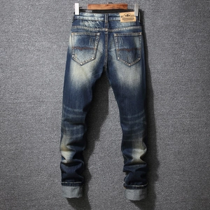 Vintage slim-fit blue distressed denim jeans for men with back pocket stitching details