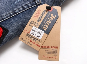 Detail of dark blue washed denim jeans with dual paper tags showing size 30 and item 896