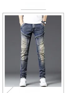Detail view of slim fit motorcycle jeans featuring vintage wash and side zipper accents