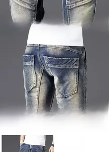 Close-up of vintage slim fit denim jeans with washed texture and deep side pockets