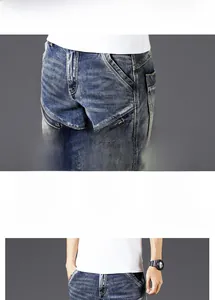 Detail of blue slim fit biker jeans with tactical zipper pockets and washed denim finish