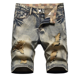 Men's vintage washed denim shorts with distressed ripped holes and street style cat-whiskers
