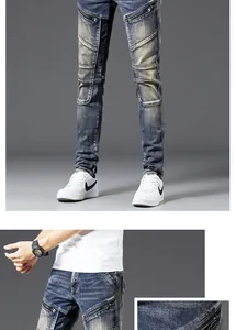 Detailed view of motorcycle style jeans featuring heavy wash, zippers, and pleated panels