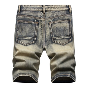 Vintage wash distressed denim shorts for men with heavy duty worn finish in a relaxed fit