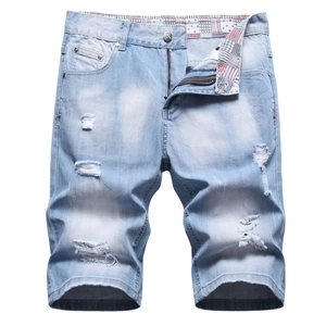 Men's light blue distressed denim shorts with ripped details and patterned inner lining