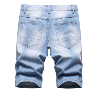 Men's light blue denim shorts in loose fit with back pockets and washed texture