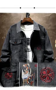 Close-up detail of vintage floral embroidery on black stretch denim jacket for men
