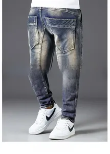 Detail of vintage denim back pocket with distressed wash and frayed hem design