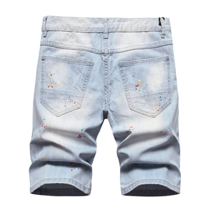 Jean bleu clair pour homme avec taches de peinture colorées et effet usé au dos
