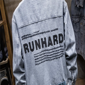 Detail of light blue denim jacket featuring back RUNHARD letter print and washed fabric