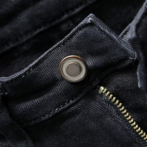 Men's slim fit black corduroy pants featuring vintage metal button and warm fleece lining