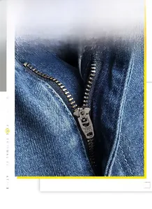 Detail shot of the durable YKK metal zipper on these blue denim jeans for men