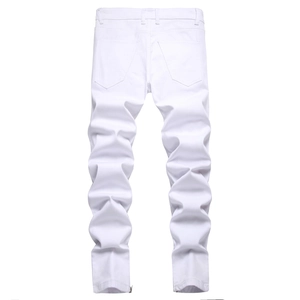 Detail view of white slim fit jeans featuring zipper accents on the ankle hem