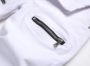 Close-up of silver metal zipper pocket and twill fabric on white slim fit jeans