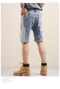 Detail of multi-tone blue patchwork denim shorts with premium leather waist label for men
