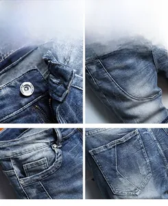 Detailed close-up of denim wear metal button, zipper fly, and classic five-pocket stitching