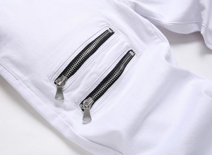 Close-up of white stretch denim pants featuring double parallel silver metal zippers
