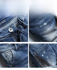 Detailed macro view showing white paint splatter and contrast patchwork on denim shorts