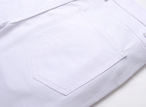 Macro shot of white slim fit jeans showing rear pocket detail and twill fabric texture