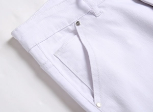 Detailed macro view of white stretch denim waist, stitching and silver JEANS rivets
