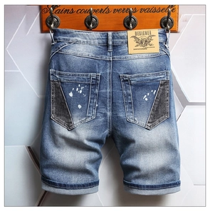 Men's denim shorts with back pocket patchwork, paint splatter, and designer leather patch