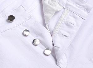 Detail view of white stretch denim pants featuring a stylish four-button metal fly closure
