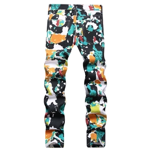 Men street art graffiti print slim fit denim pants featuring vibrant multicolor paint splash