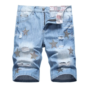 Men's light blue distressed denim shorts with star embroidery and ripped star patches
