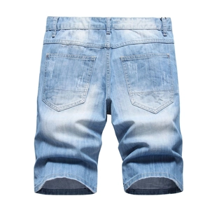 Men's light blue distressed denim shorts with star embroidery and ripped back pockets