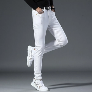 Slim fit white jeans for men showing stretch fabric and flexibility in side leg pose