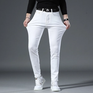 Detail view of men's slim fit white stretch jeans with black leather animal buckle belt